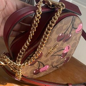 Coach Cherry Print Round Crossbody in Burgundy and Pink